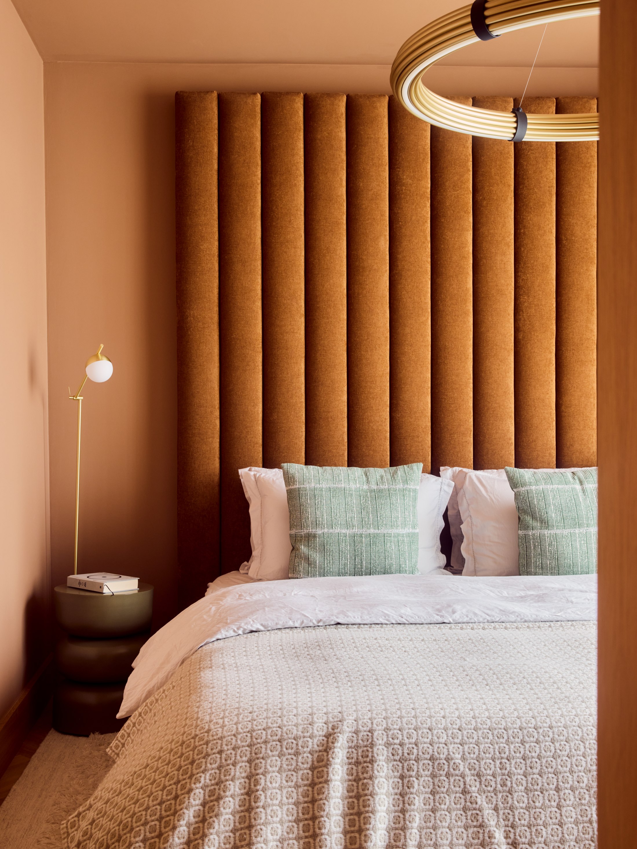 A Matt Smith-Wood interior, terracotta fluted headboard