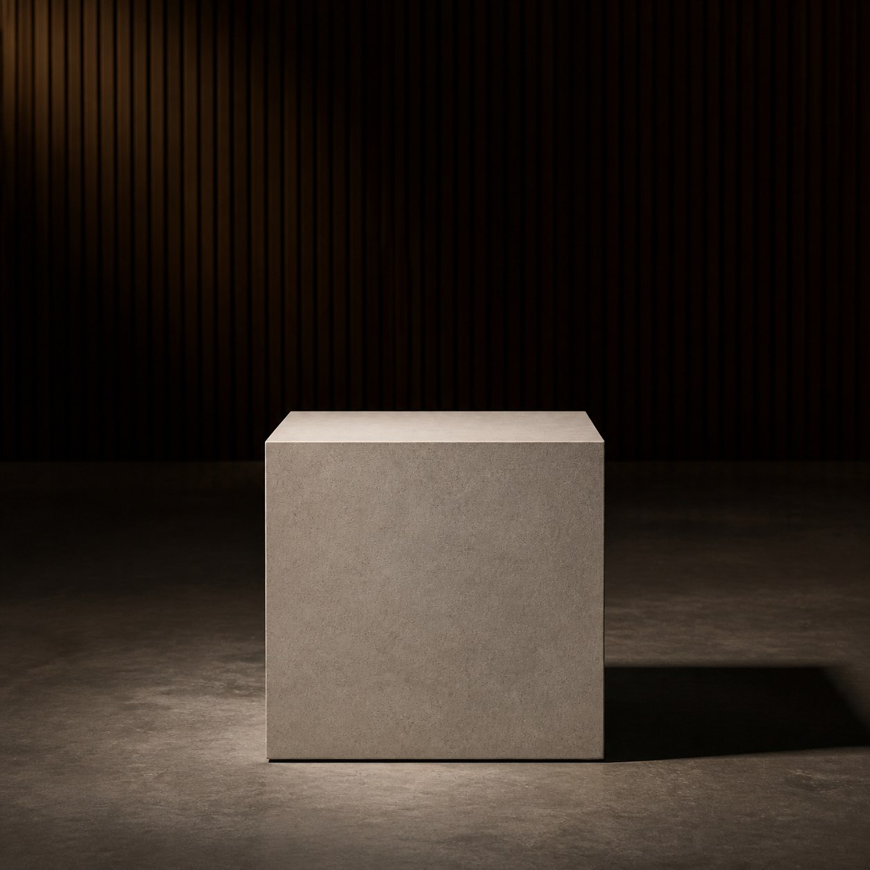 A concrete plinth in a dark fluted room