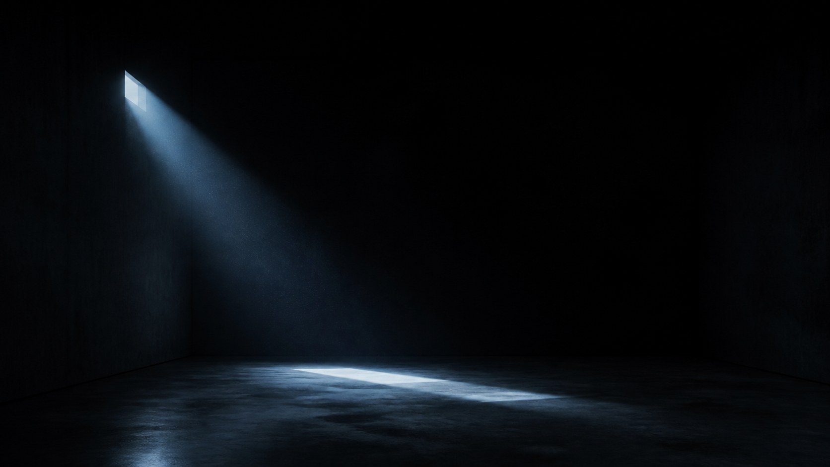 A near-black room, one cool shaft from the upper left
