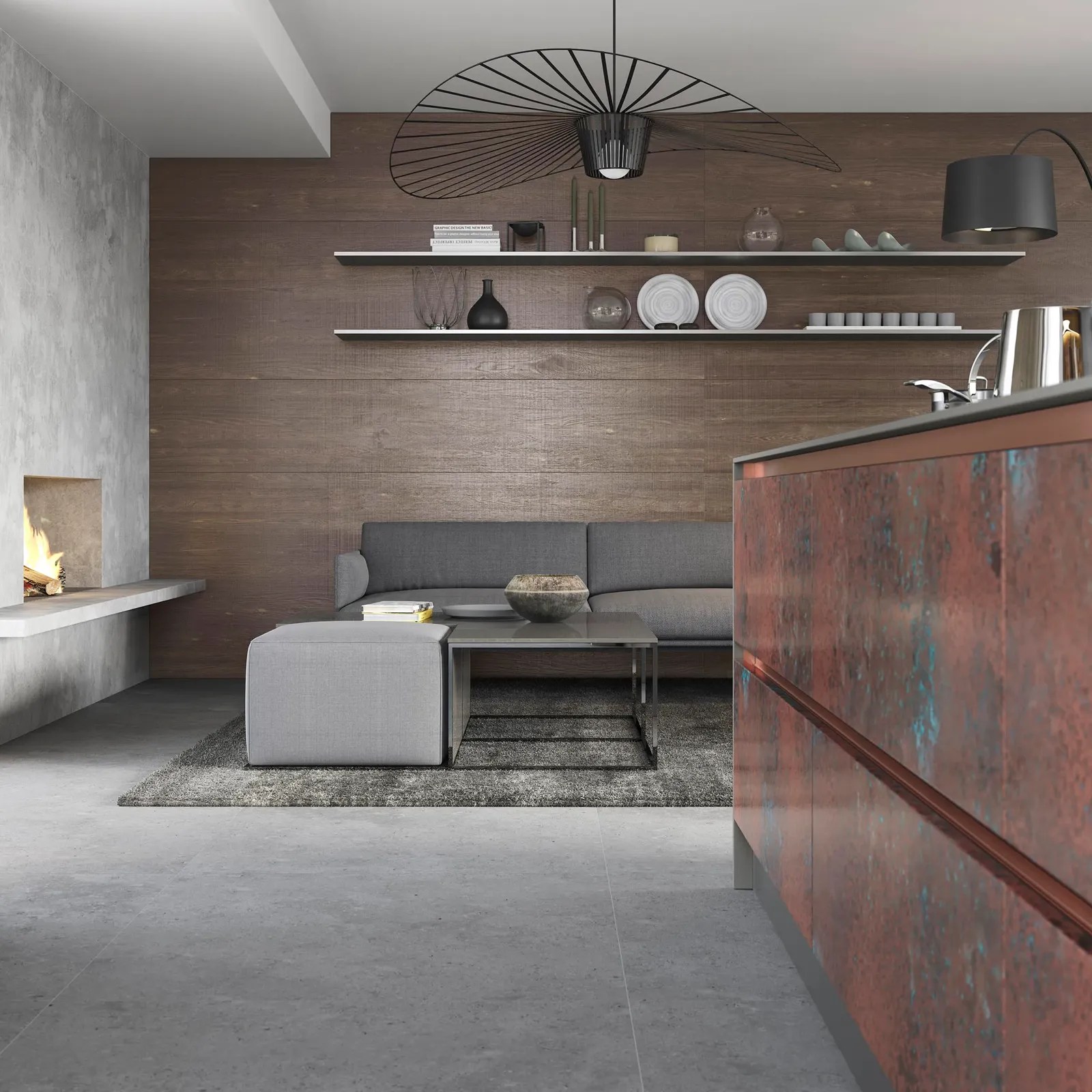 Oxidised copper kitchen island viewed from the adjoining living space with a fireplace
